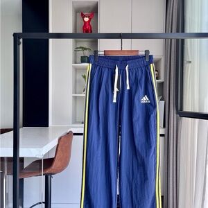 Adidas Blue Track Pants with Yellow Stripes
